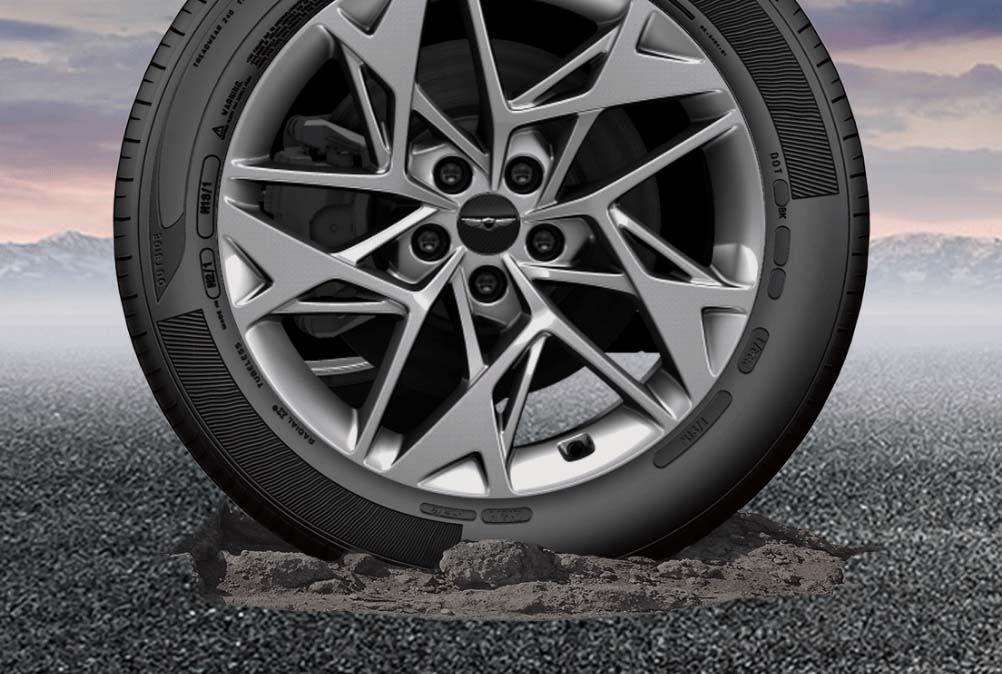 Wheel and tire in pothole